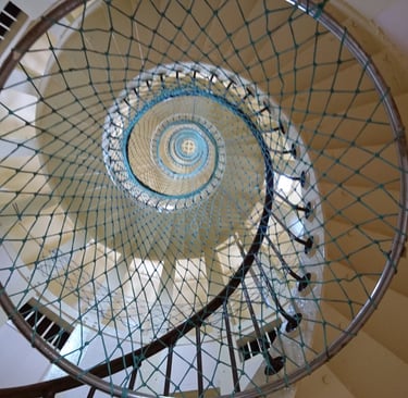 a spiral staircase way with a spiral staircase