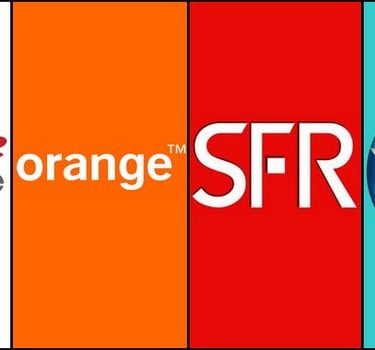 a group of people standing in front of a group of oranges