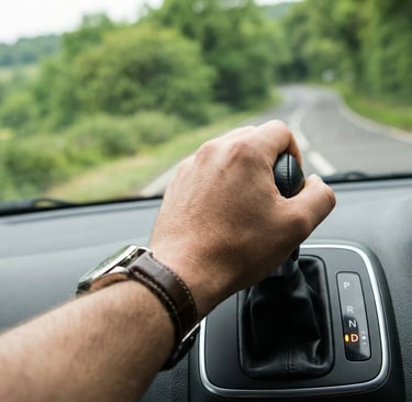 Learner driver shifting into drive during automatic driving lessons in Loughton