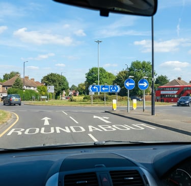 View from a learner driver car approaching a large roundabout near Chingford