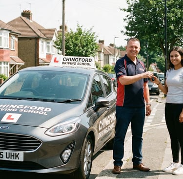 Instructor from a driving school in Chingford handing car keys to a student after a lesson.