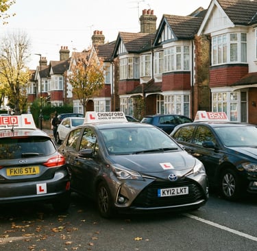 Learner cars from driving schools in Chingford parked on a quiet residential street