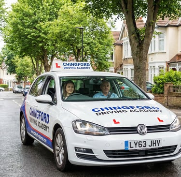 Learner driver during a lesson with a driving school in Chingford on a residential street.