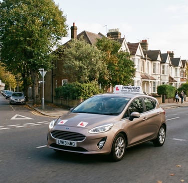 Learner driver approaching a junction during driving lessons near Chingford.