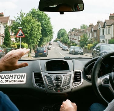 Driving instructor in Loughton guiding a student through a hill start on a residential road.