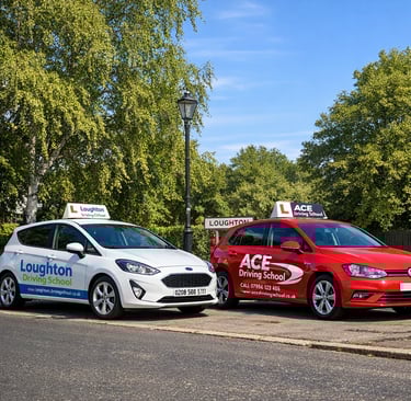 A fleet of cars from professional driving schools in Loughton lined up on a local street