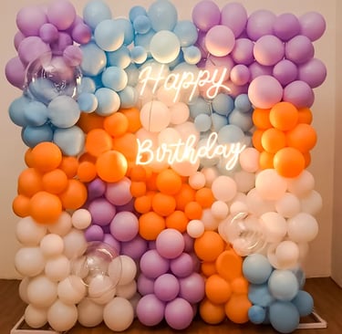 Colorful balloon photo wall backdrop with vibrant balloons, perfect for 1st birthday memories.