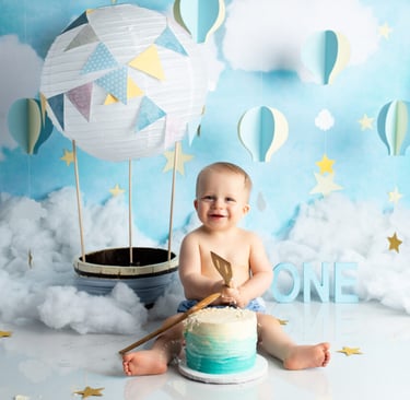 Playful balloon setup for a smash photoshoot, capturing fun moments from a 1st birthday celebration.