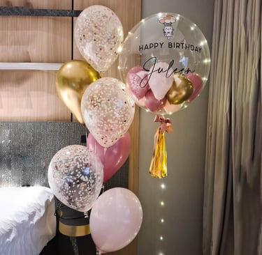 Custom balloon bouquets with the child’s name and age for a vibrant 1st birthday celebration.