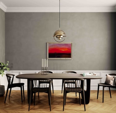 Modern dining room with a dark wood table, black chairs, gold pendant light, and sunset wall art.