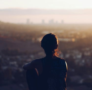 Girl looking at the ruin at dusk. 