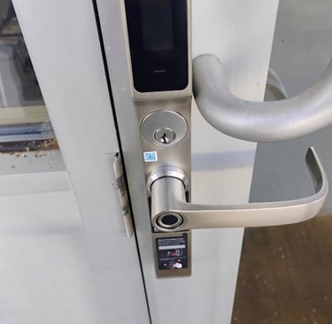 Biometric keypad smart lock on commercial building entrance