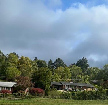 Three residential homes in Spruce Pine, NC, representing secure neighborhoods with locksmith services for rekeying