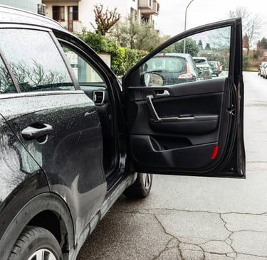 Black luxury car door unlocked representing emergency car lockout services in Spruce Pine, NC