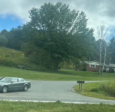 A grey Chrysler 300 merging on highway representing locksmith service for lockouts, spare keys, & igntion repair