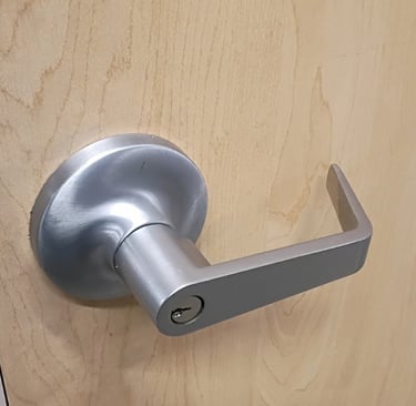 Office door lever lock rekeyed by commercial locksmith in Asheville NC.
