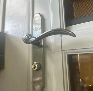 Door keyhole representing residential locksmith services in Fletcher, NC including smart locks, rekeying, & lockout
