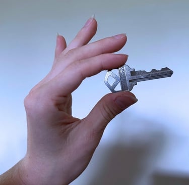 Hand holding a key for duplication service in Asheville