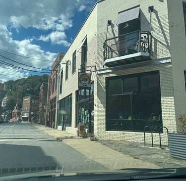 White Brick building Marshall, NC— On Your Bike, shown as part of Asheville Locksmith Now's service area