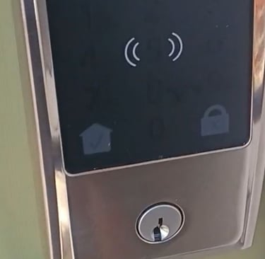Smart keypad deadbolt lock installed on a residential door in Asheville, NC
