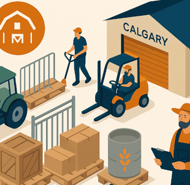 Large farm equipment staged in a Calgary warehouse before delivery to Aggie Days at BMO Centre.