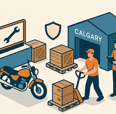Motorcycles and exhibitor crates staged in a Calgary warehouse before delivery to the Motorcycle & P