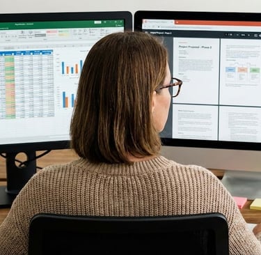 woman looking at computer screens