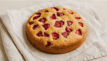 a cake with a strawberry pie crust crust and a strawberry pie
