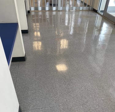 GRAY TILE FLOORS WITH A HIGH POLISH FINISH PENNICLE BUILDING MAINTENANCE