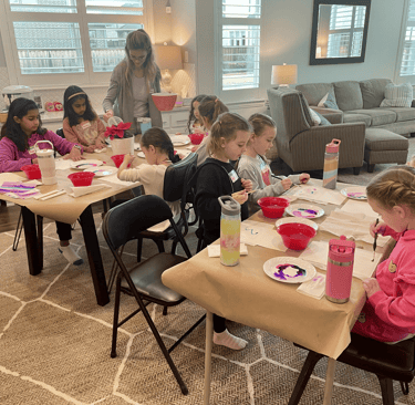 Kids enjoying watercolor painting lessons with instructor Kelley at Kelley’s Neighborhood Art.
