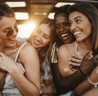 a group of friends hanging out in the back of a car