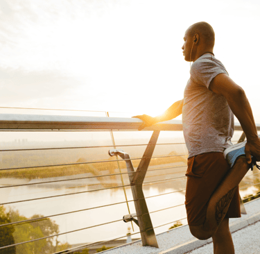 a man standing on a balcony railing railing railing