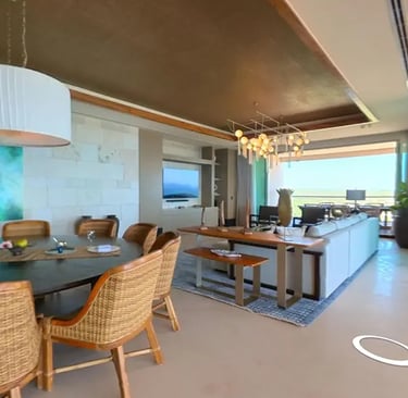 a living room with a dining room and a dining room