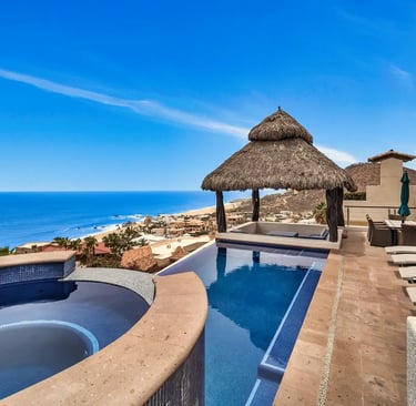 Luxury villa with palapa and infinity pool overlooking the ocean in Pedregal, Cabo San Lucas.