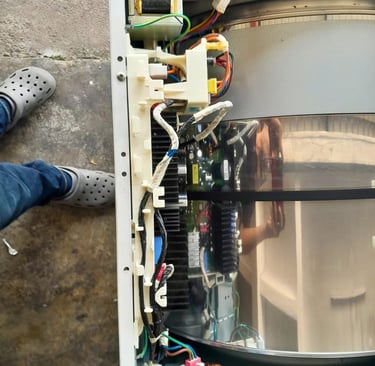LG heat pump dryer main control board exposed for no power diagnosis – showing wiring harness, relay