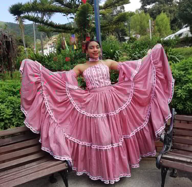 A dancer of Cumbia with a traditional dance costumbe