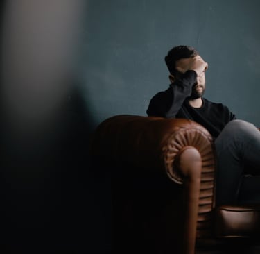 Frustrated guy sitting on chair