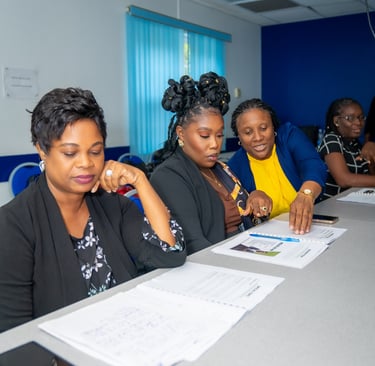 a group of people sitting at a table resolving a problem together
