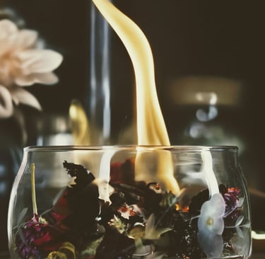 Image of a bowl filled with flowers and herbs on fire