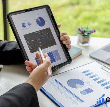 A person pointing on sales metrics on a tablet 