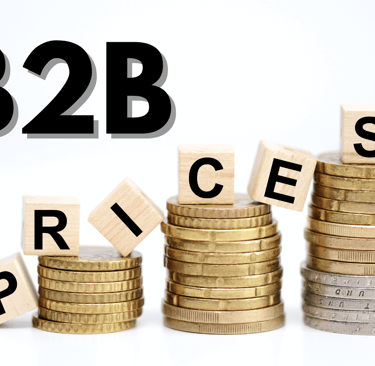 stacked coins with wooden blocks spelling B2B prices