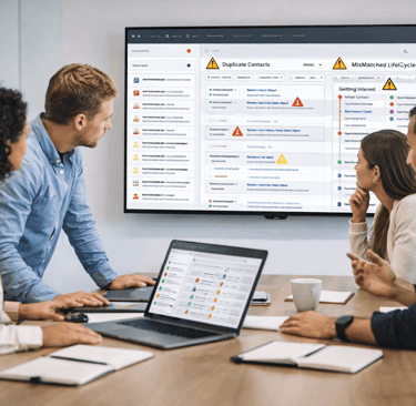 SDR team reviewing CRM errors in a meeting room