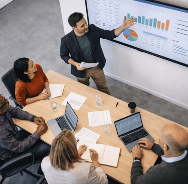 diverse team in meeting led by decision maker