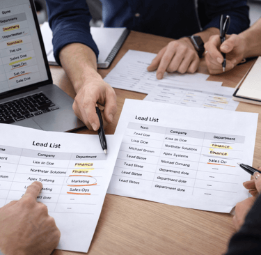 SDR team reviewing lead lists by department