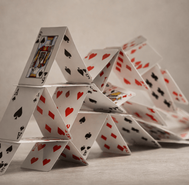 collapsing house of cards instability concept