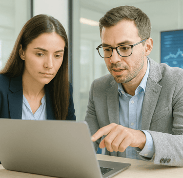 FinTech professionals reviewing data together in a bright modern office