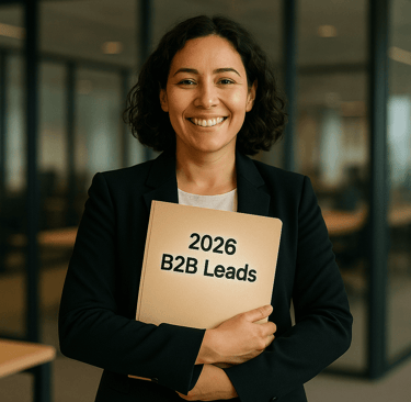 Woman founder happily holding a folder labeled 2026 B2B Leads in a modern office