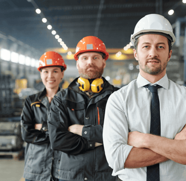 Industrial workers and manager in a factory