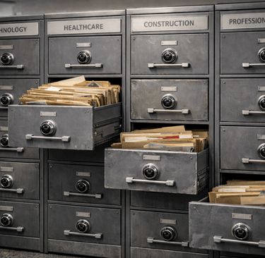 Steel filing cabinets showing industry-based data organization differences