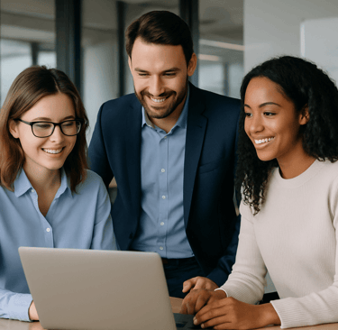SaaS professionals collaborating around a laptop in a modern office.